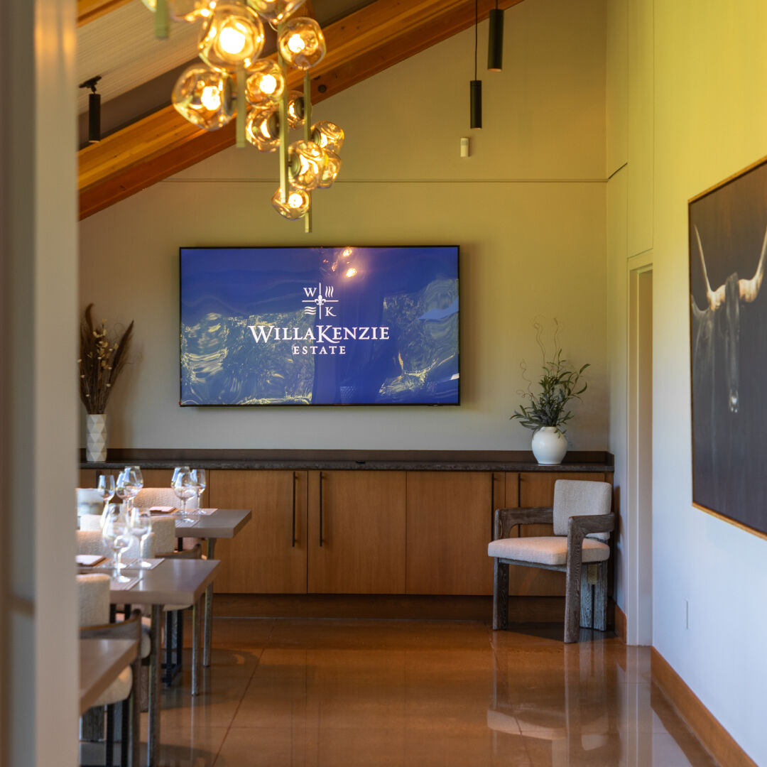 WillaKenzie Logo on mounted large tv screen inside the new tasting room.